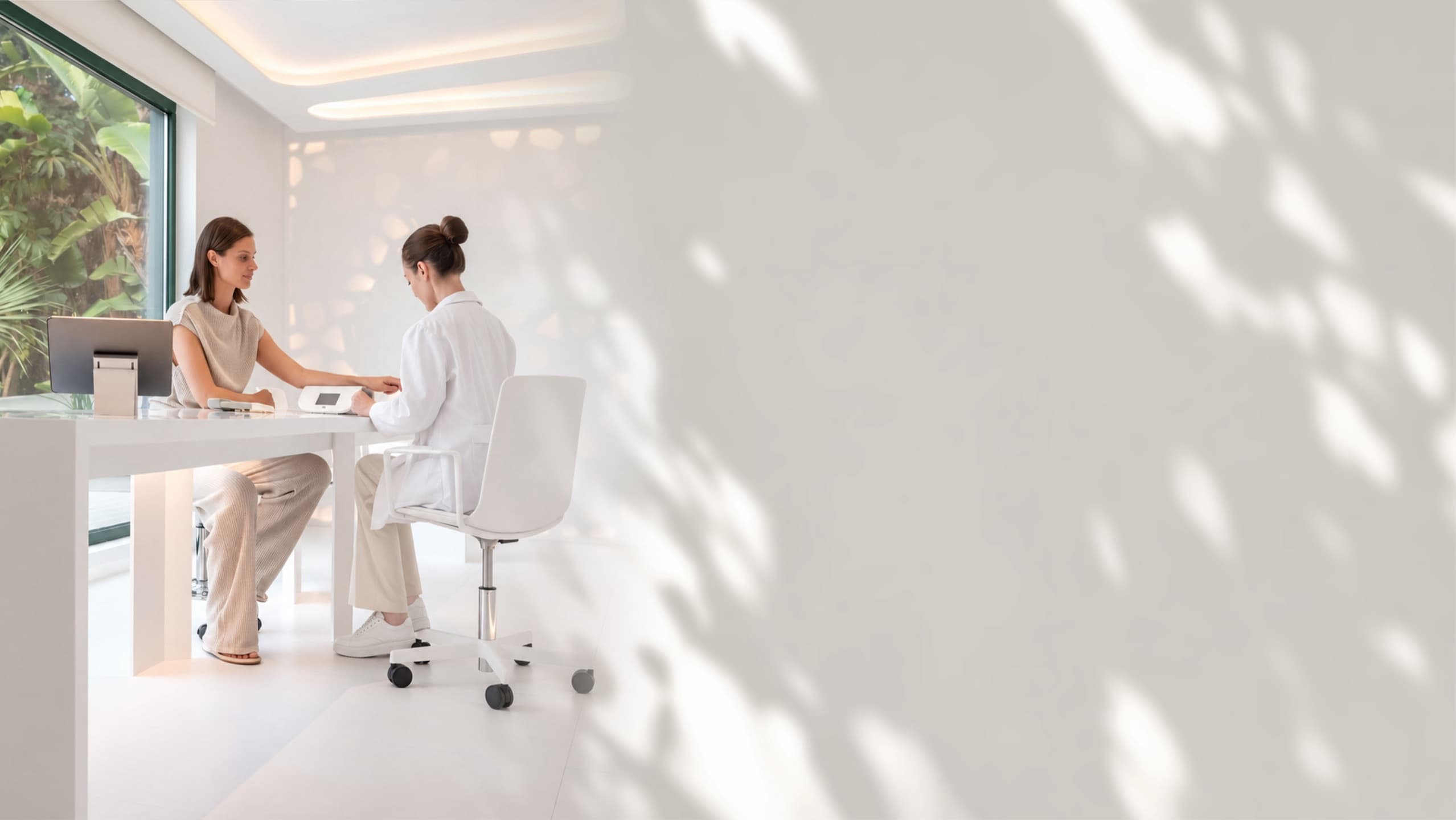 A guest meeting a longevity physician in a bright clinic